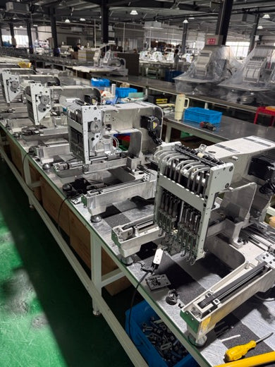 EmbNova production line with embroidery machines in assembly
