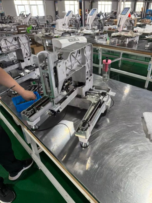 EmbNova machine being assembled by a technician